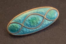 antique Art Nouveau silver and enamel brooch by James Fenton.