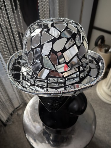 Hand mirrored bowler hat - hand,