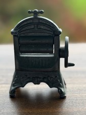 Vintage metal miniature doll