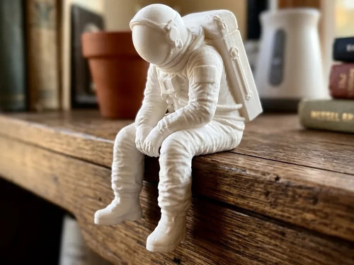 Astronaut sitting edge statue - sitting,