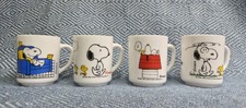 Four Snoopy Milk Glass Mugs -