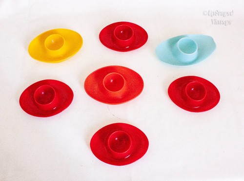 Seven plastic egg cups - cups, red