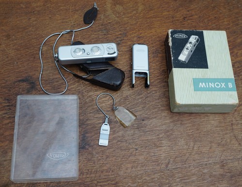 Minox - , b