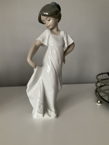 Nao lladro girl holding - by,