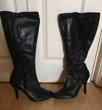 Unusual frilled black boots