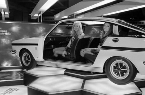 Models pose within cutaway - within, a