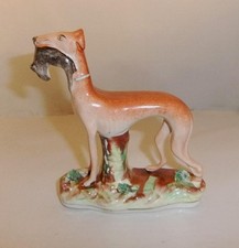 C.19th Staffordshire Figure of a Dog / Greyhound holding a Rabbit:13 cm long