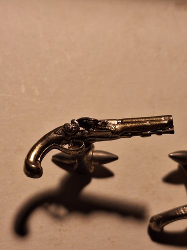 Gilt metal flintlock - gilt,