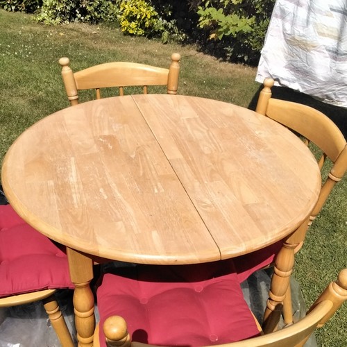 Round light wood dining table - round,