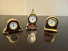 A set of three miniature brass