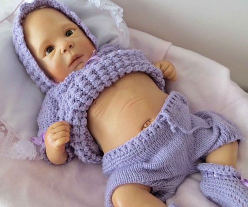 One kind clay doll by - one,
