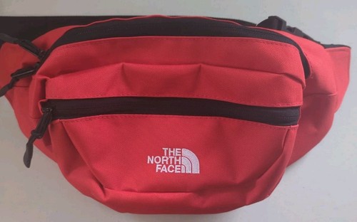 Red north face lumbnical - face,