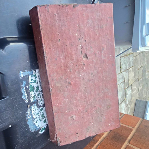 Red perforated clay building - perforated,