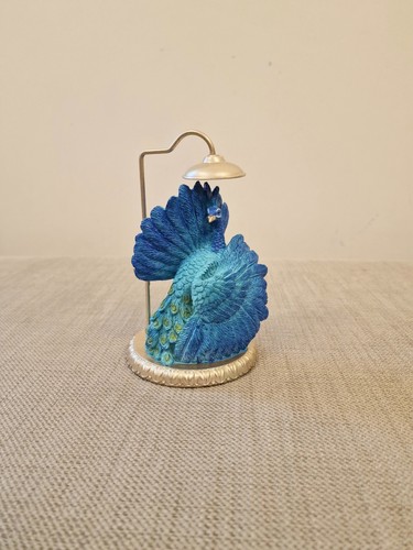 Peacock ornament next blue - peacock,