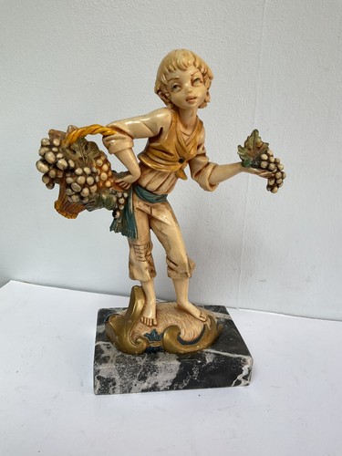 Vintage figurine boy with - of, a