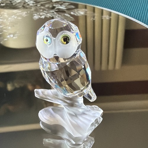 Swarovski owl perched on - owl,