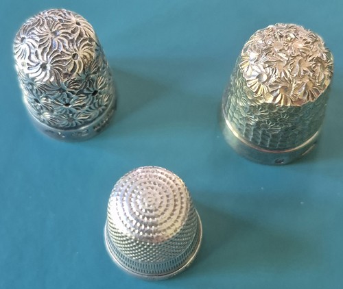 Three antique silver thimbles
