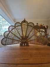 An Antique Art Nouveau Brass Peacock Fire Guard