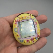 Yellow multi coloured Tamagotchi 2004