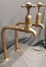 TALL BRASS BIB TAPS, AGED