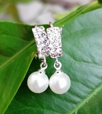 Silver tone hanging pearl hoop