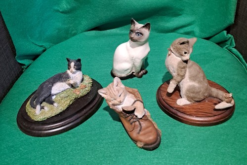 Three cat figurines from - figurines,
