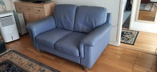 Blue Leather two seater sofa and footstall