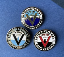 International Twin Pin Badges