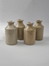 4 WHITE STONEWARE BOTTLES