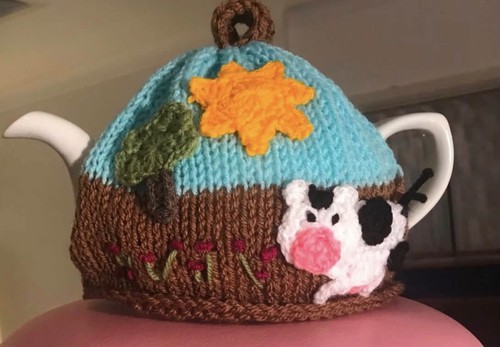 Knitted tea cosy with - knitted, cow