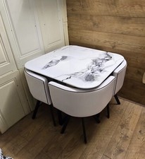 wood or Marble  Dining table and 4 chairs ./