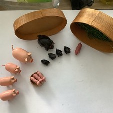 A Collection Of  13 Tiny Pig Ornaments In A Box,