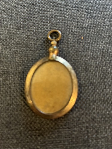 Gold colour locket marked - locket,