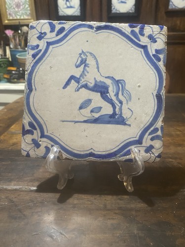 Dutch delft tile depicting - a, a