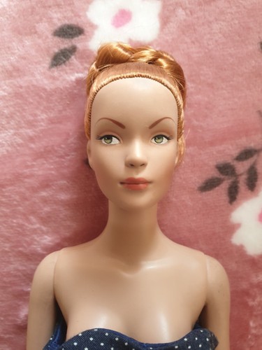 Tonner doll with stand - with, stand.