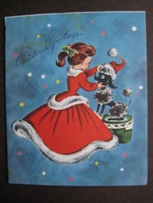 1950s vintage greeting card Superb CHRISTMAS Girl Puts Santa Hat on Black Poodle