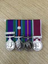 4 MINIATURE MEDALS COURT