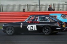 PHOTO  SILVERSTONE 2016  MARK BENNETT AT BROOKLANDS IN HIS 1974 MGB GT V8 DURING
