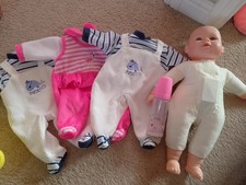 Talking baby doll + clothes +
