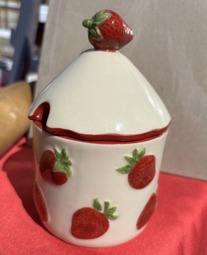 Strawberry jam pot with - , lid.
