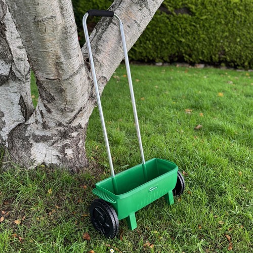 Lawn seed spreader feed and - feed,