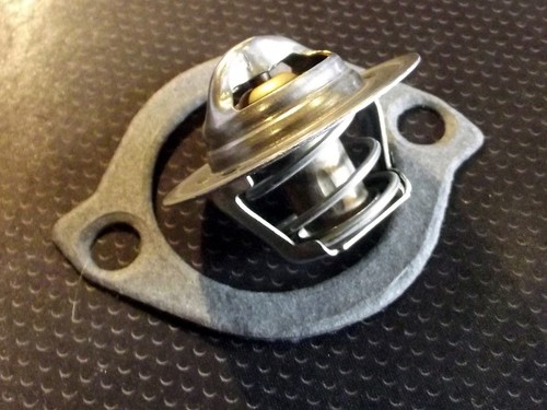 Thermostat and gasket for