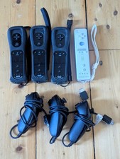 X3 Official Nintendo Wii Black Remote Motion Plus and Nunchucks 