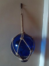 LOVELY FINE HAND BLOWN BLUE GLASS WITCHES BALL  IN STRING NET . M3869