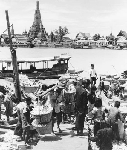 Goods are unloaded from boat - a,