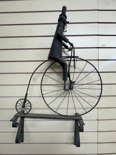 Man penny farthing bike - a,