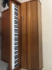 Brown Eavestaff Piano, made from real wood. Has been used, has 2 pedals