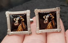 Pair Of Silver Plated Caroline Shotton 'Cow With The Pearl Earring Cufflinks 