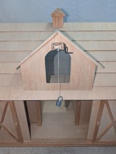 Breyer Deluxe Wooden Barn is a 1:9 scale horse stable made of wood, by Breyer