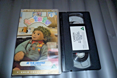 Tots the dentist - at,